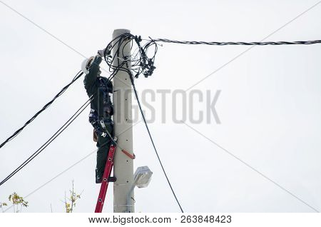Athens, Acharnes, Stratopaido Kapota/ Greece - October 18 2018: Electrician Technician Worker Cut Ca