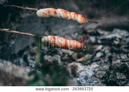 Stick Bread On A Stick Over A Fire In Summer