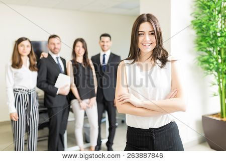 Positive Female Business Tycoon Smiling While Leading Organization