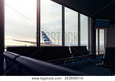 Airport lounge with background view of airplane through window