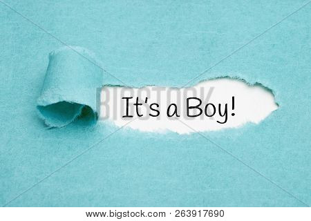 Announcement It Is A Boy Appearing Behind Ripped Blue Paper.
