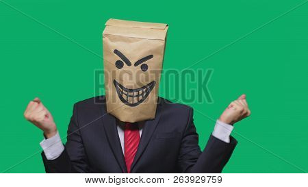 Concept Of Emotion, Gestures. A Man With A Package On His Head, With A Painted Smiley Angry, Sly, Gl