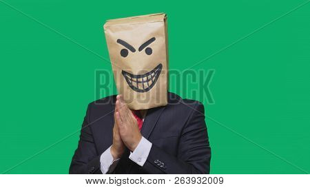 Concept Of Emotion, Gestures. A Man With A Package On His Head, With A Painted Smiley Angry, Sly, Gl