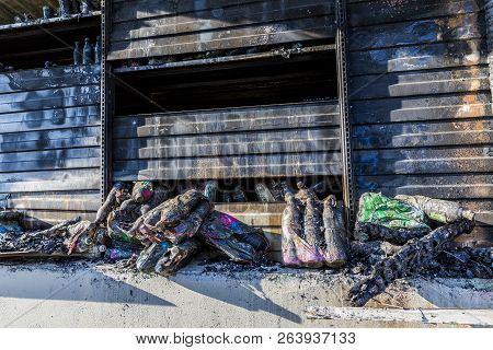 Close Up Damaged Industry Supermarket Metallic Facade After Arson Fire With Burn Debris Of Plastic B