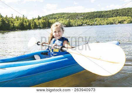 Summer Vacation Portrait Of Happy Cute Girl Kayaking The On River