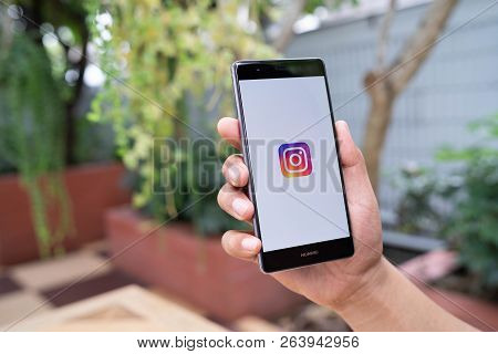 Chiang Mai, Thailand - August 05,2018: Man Handsholding Huawei With Instagram Application On The Scr