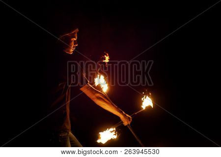 Fire Show. Fakir Dances With Two Staff. Night Performance. Fire And Smoke. Fascinating Flame Movemen