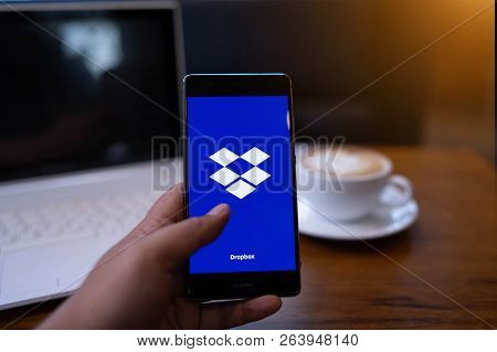 Chiang Mai, Thailand - May 19,2018: Man Hands Holding Huawei With Dropbox On Screen. Dropbox Is A Se