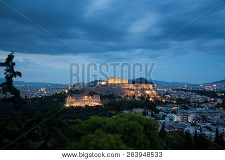 athens seen from Philopapou hill with views to Herodium , Acropolis and the Parthenon at blue hour, Attica, Greece