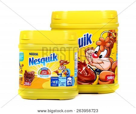 Novyy Urengoy, Russia - October 18, 2018: Yellow Cans Of The Nestle Nesquik Cocoa Isolated Over Whit