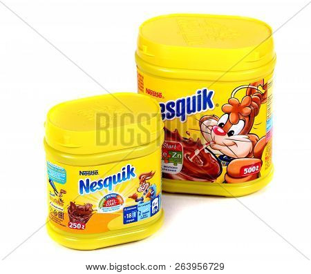 Novyy Urengoy, Russia - October 18, 2018: Yellow Cans Of The Nestle Nesquik Cocoa Isolated Over Whit