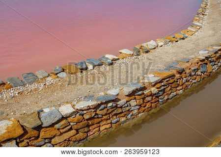 Pink Salt Pool In Saltmine And Canal