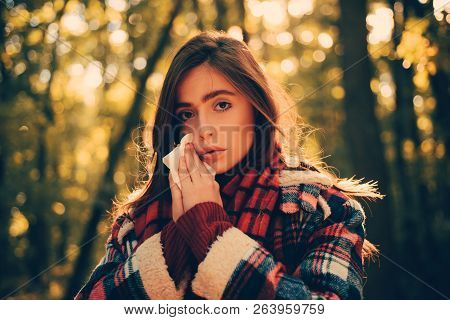Cold Flu Season Runny Nose. Woman With Allergy Symptoms Blowing Nose. Portrait Of Young Woman Sniffi