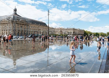 Bordeaux, France - July 22, 2018: People Enjoying On The Water Mirror. Located Across From Place De 