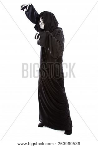 The grim reaper or death halloween costume isolated on a white background.  The skeleton is wearing