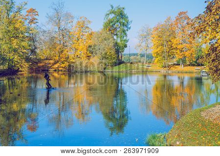 City Cesis, Latvia. Old Casttle Park At Autumn. Yellow Leafs, Lake And Fountain. Travel Photo 2018.