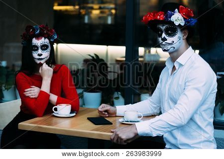 A Couple, Wearing Skull Make-up For. All Souls Day. Boy And Girl Sugar Skull Makeup.painted For Hall
