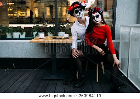 A Couple, Wearing Skull Make-up For. All Souls Day. Boy And Girl Sugar Skull Makeup.painted For Hall