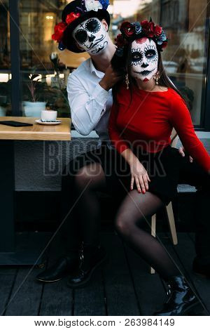 A Couple, Wearing Skull Make-up For. All Souls Day. Boy And Girl Sugar Skull Makeup.painted For Hall