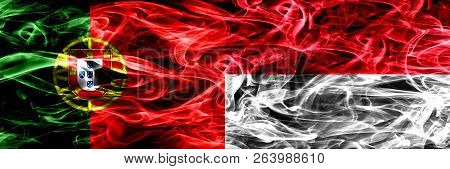 Portugal Vs Monaco, Monacan Smoke Flags Placed Side By Side. Thick Colored Silky Smoke Flags Of Port
