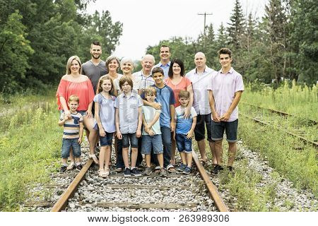 Large Family With Cousin Grandparent Father And Kid On A Forest