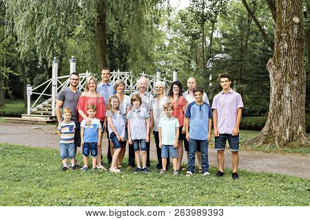 Large Family With Cousin Grandparent Father And Kid On A Forest