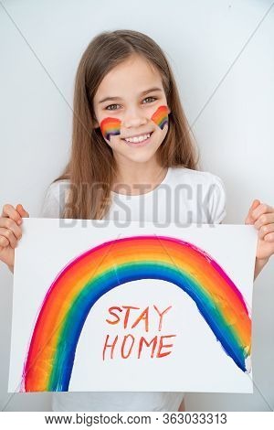 Happy Teen Girl With Blond Hair Drew A Rainbow And A Poster Stay Home. Flashmob Chasetherainbow.