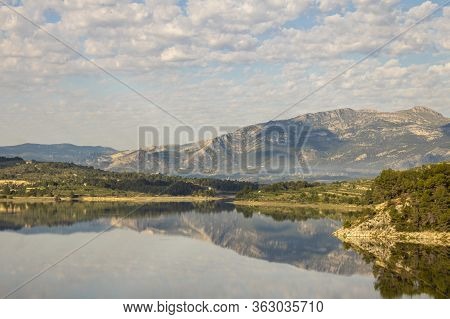 Swamp Of Beniarres One Day With White Clouds Reflected In The Water, Beniarres, Alicante, Spain.