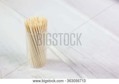 Bamboo Toothstick In A Case Over The White Table. Great Photo For Your Needs.