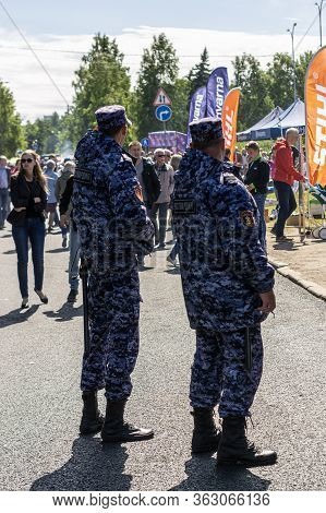 Petrozavodsk, Russia - 29 June 2019. Two Employees Of The Rosgvardia, Russian National Guard, Follow