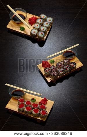 Tasty And Delicious Hot And Cold Sushi Rolls On The Table. Different Sushi - Rolls With Sauce On The