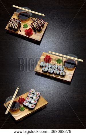 Tasty And Delicious Hot And Cold Sushi Rolls On The Table. Different Sushi - Rolls With Sauce On The
