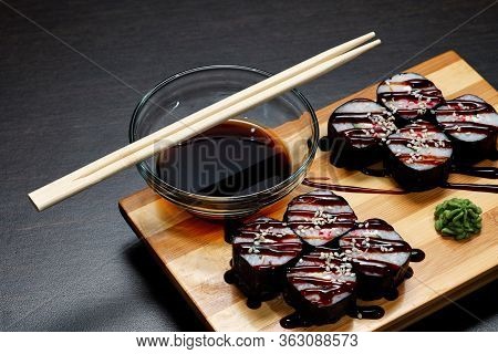 Tasty And Delicious Hot And Cold Sushi Rolls On The Table. Different Sushi - Rolls With Sauce On The
