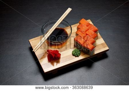 Tasty And Delicious Hot And Cold Sushi Rolls On The Table. Different Sushi - Rolls With Sauce On The