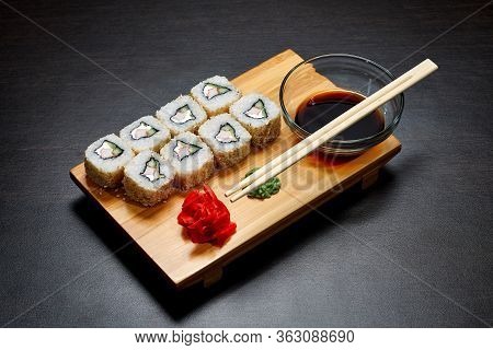 Tasty And Delicious Hot And Cold Sushi Rolls On The Table. Different Sushi - Rolls With Sauce On The