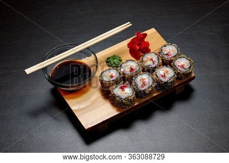 Tasty And Delicious Hot And Cold Sushi Rolls On The Table. Different Sushi - Rolls With Sauce On The