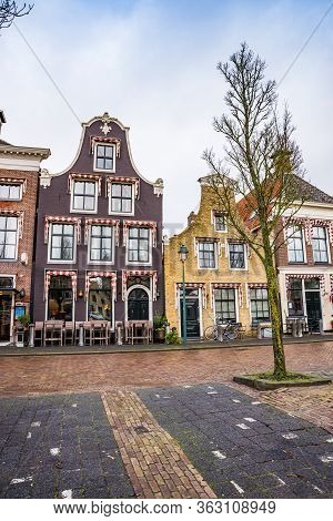 Harlingen, Netherlands - January 10, 2020. Zuiderhaven Street In Winter With Traditional Dutch House