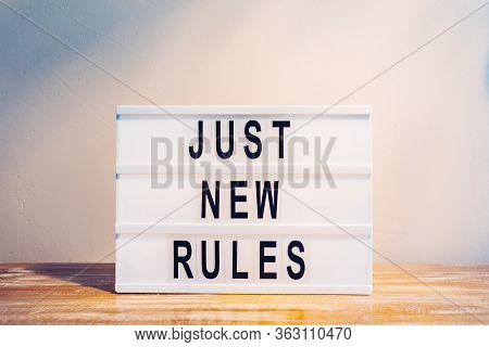 The Words Just New Rules On The Lightbox. New Beginnings, New Life Or New Business Concept