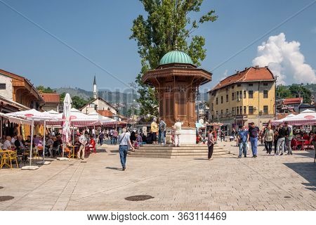 Sarajevo, BiH - August 27, 2019: Bascarsija square with Sebilj wooden fountain in Old Town Sarajevo in Bosnia and Herzegovina