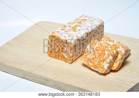 Slice Of Tempeh On Table, Tempeh Is Traditional Food From Indonesia.