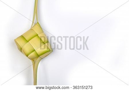 Ketupat, A Type Of Dumpling Made From Rice Packed Inside A Diamond-shaped Container Of Woven Palm Le