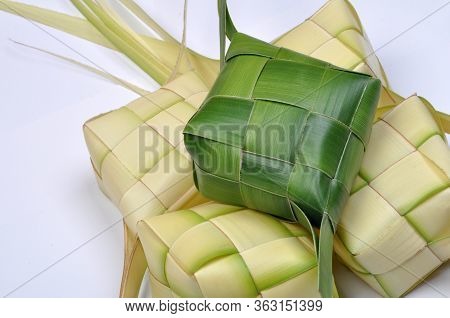 Ketupat, A Type Of Dumpling Made From Rice Packed Inside A Diamond-shaped Container Of Woven Palm Le