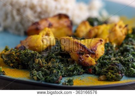 Closeup Of Indian Murgh Palak Dish With Rice