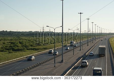 View From The Top To A Large Highway With Lanterns And A Dividing Strip, Cars Go In Different Direct