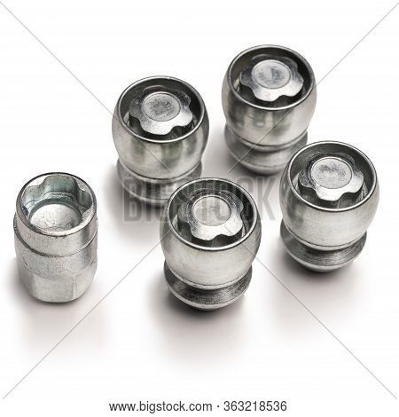Car Lock Nuts, Wheel Nut That Protect The Wheels From Theft. Close-up Of The Isolate On A White Back