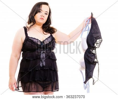 Plus Size Adult Woman Choosing Perfect Bra For Her Breasts. Female Wearing Sensual Black Chemise Nig