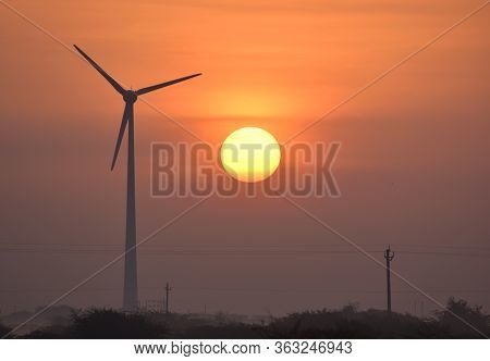 Windmill And Sunrise Wind Energy And Power