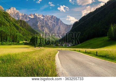 Beautiful Summer Alpine Landscape, Flowery Meadows And High Snowy Mountains At Sunset, Logar Valley 