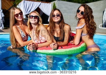Beautiful Hot Pretty Girls In Bikini Are Swimming In A Pool On An Inflatable Watermelonswim Ring Flo
