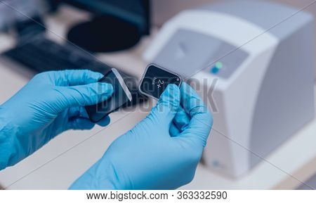Aiming Dental Radiography. Packing The Sensor In Individual Case